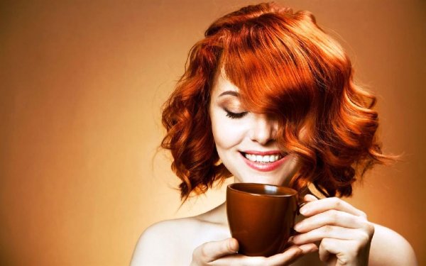red hair woman with coffee cup