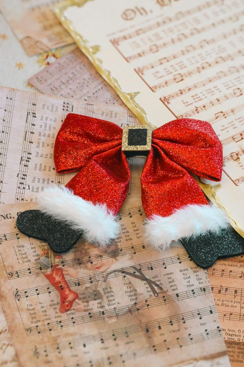 christmas, christmas decoration, red bow, festive, holiday, glitter, vintage, sheet music, music notes, nostalgic, winter, xmas, antique paper, retro, cozy, seasonal background, greeting card, christmas card, decor, warm tones, handmade, celebration, still life, holiday background, music theme