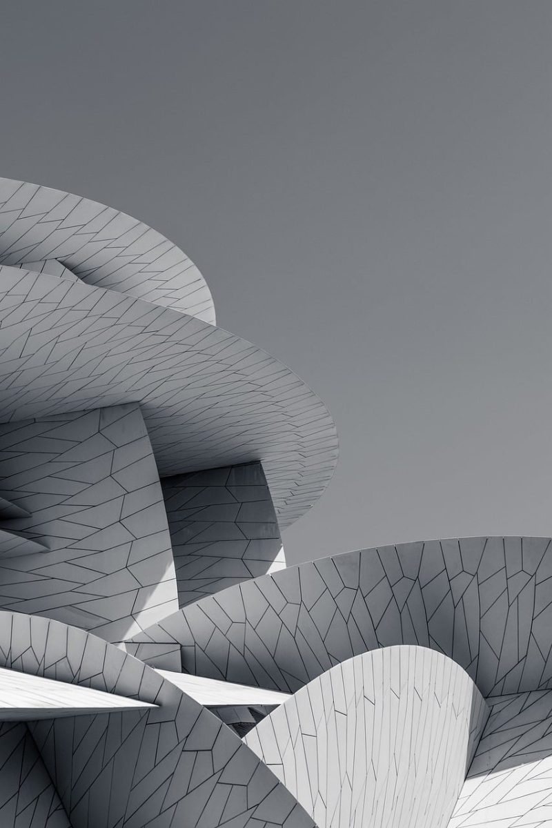 national museum of qatar, architecture, modern, curved, desert rose, doha, futuristic, blue sky, facade, museum, sand-colored, steel construction, middle eastern design, cultural, iconic, geometric, symmetrical, modern art, extravagant, arab culture