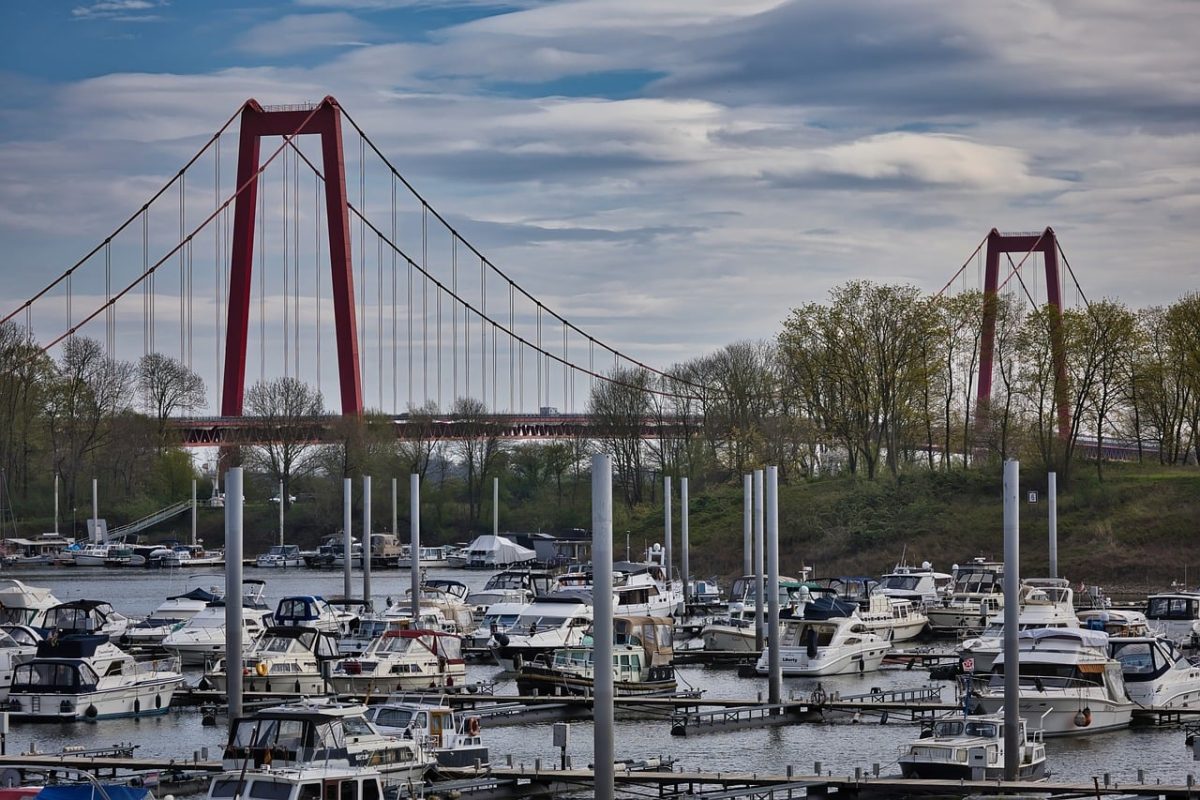 bridge, red, river, boat, harbor, yachts, trees, nature, architecture, pole, blue sky, clouds, spring, horizon, shadow, travel, cityscape, traffic, metal construction, sailing