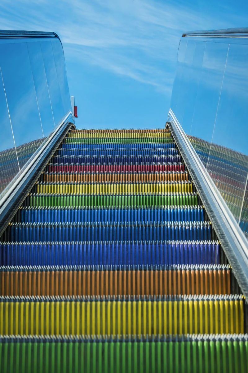 rainbow colors, escalator, urban, modern, architecture, sky, public space, design, colorful, movement, outdoor, transportation, tourism, infrastructure, durability, safety, futurism, travel, technology, artistic