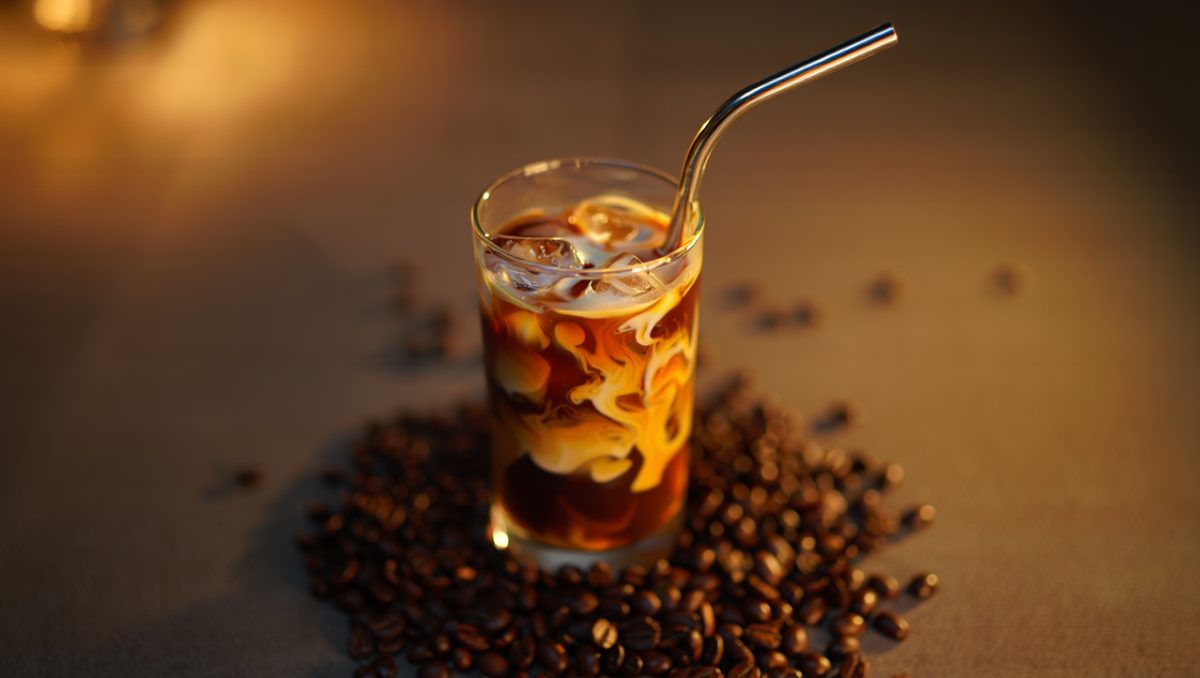 iced coffee, metal straw, ice, coffee, milk, espresso, cold drink, coffee beans, dark background, moody lighting, coffee and milk, glass, swirling milk, coffee brewing art, coffee shop, slow motion, close-up, comfort drink, elegant look, toward plastic bans