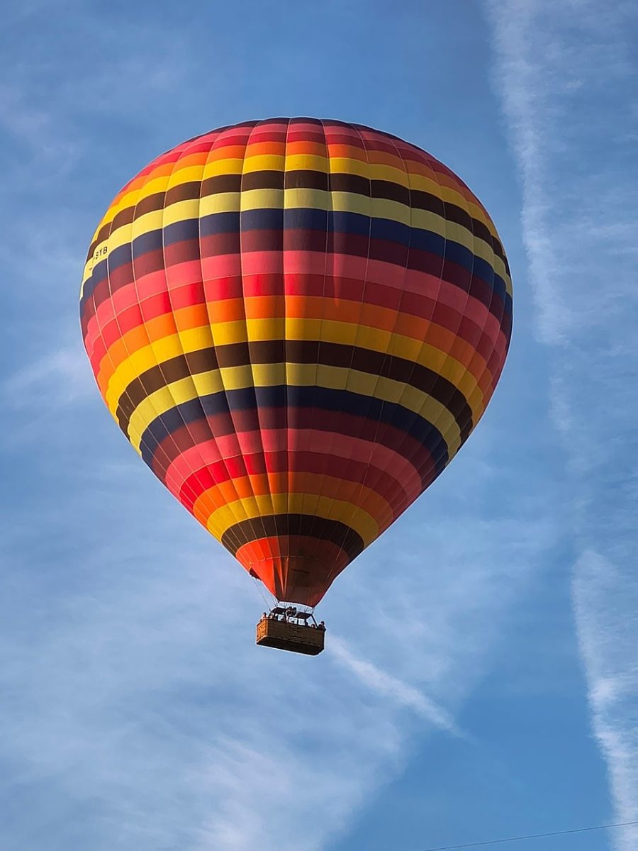 hot air balloon, blue sky, red, yellow, colorful stripe, adventure, mode of transport, travel, recreation, tourist attraction, cheerful, cloud haze, excursion, entertainment, high, lightness, climbing, view, balloon flight