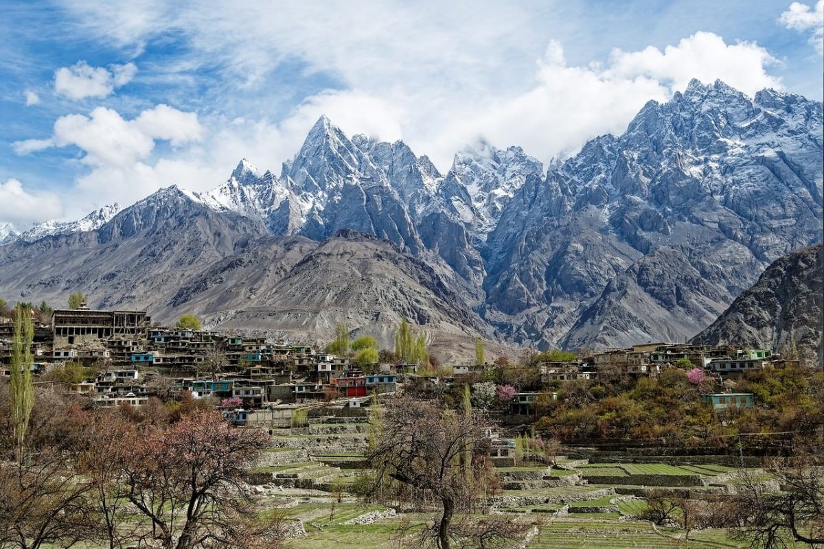 pakistan, gilgit-baltistan, karakoram, mountains, snow, natural, sky, clouds, village, spring, trees, purple, landscape, houses, agriculture, purple trees, rock formation, village landscape, agricultural terraces, spring blossoms, settlement