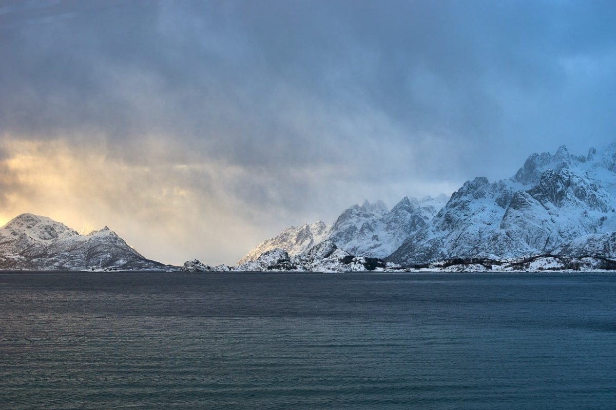 mountains, fjord, winter, snow, nature, water, landscape, winter scene, frozen landscape, nordic fjords, sunset, winter landscape, dramatic sky, rainy, sea, stormy sky, natural beauty, cold, nordic nature, harsh landscape