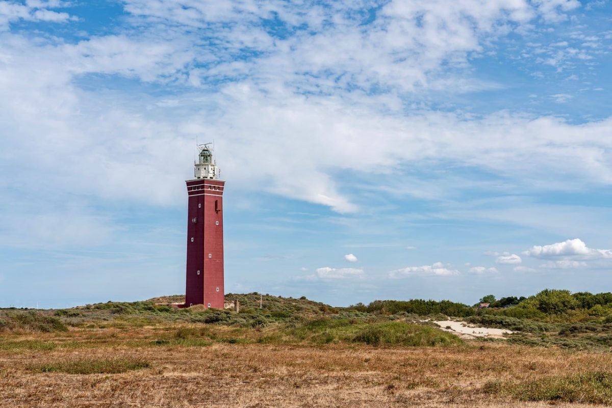 lighthouse, nature, landscape, horizon, holland, netherlands, dunes, red, white, rural, travel, tourist attraction, coast, blue sky, tranquility, afternoon, serene landscape, architecture, seaside, color contrast