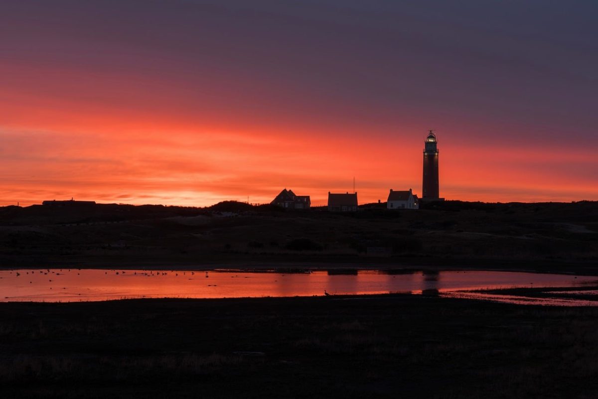 sunset, lighthouse, texel, holland, sea, landscape, setting sun, black clouds, western european landscape, calm water, building silhouette, evening landscape, soft light, silhouette, landscape silhouette, silence, western part, coast, street light