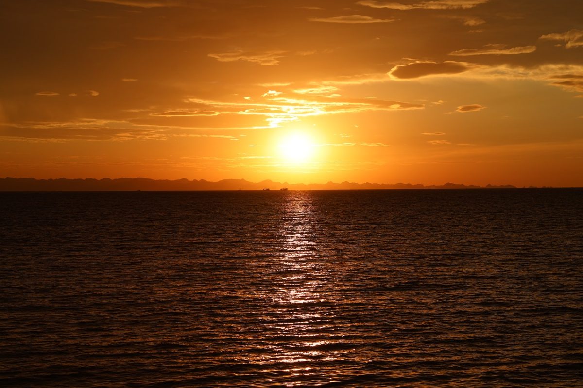 sunset, ocean, sea, horizon, golden hour, sun, water, golden light, mountains, orange sky, nature, landscape, reflection, tranquil, calm, dusk, twilight, evening, sea wave
