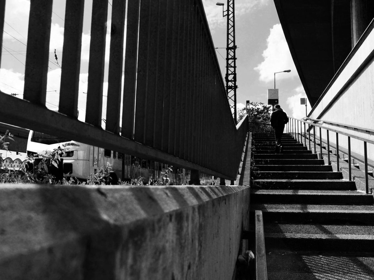 stairs, black-and-white, architecture, city, perspective, people, strong contrast, urban environment, pedestrian, railway, concrete, industrial, railway bridge, city photography, street photography, railing, transport infrastructure, angle of view, vertical composition, urban transport