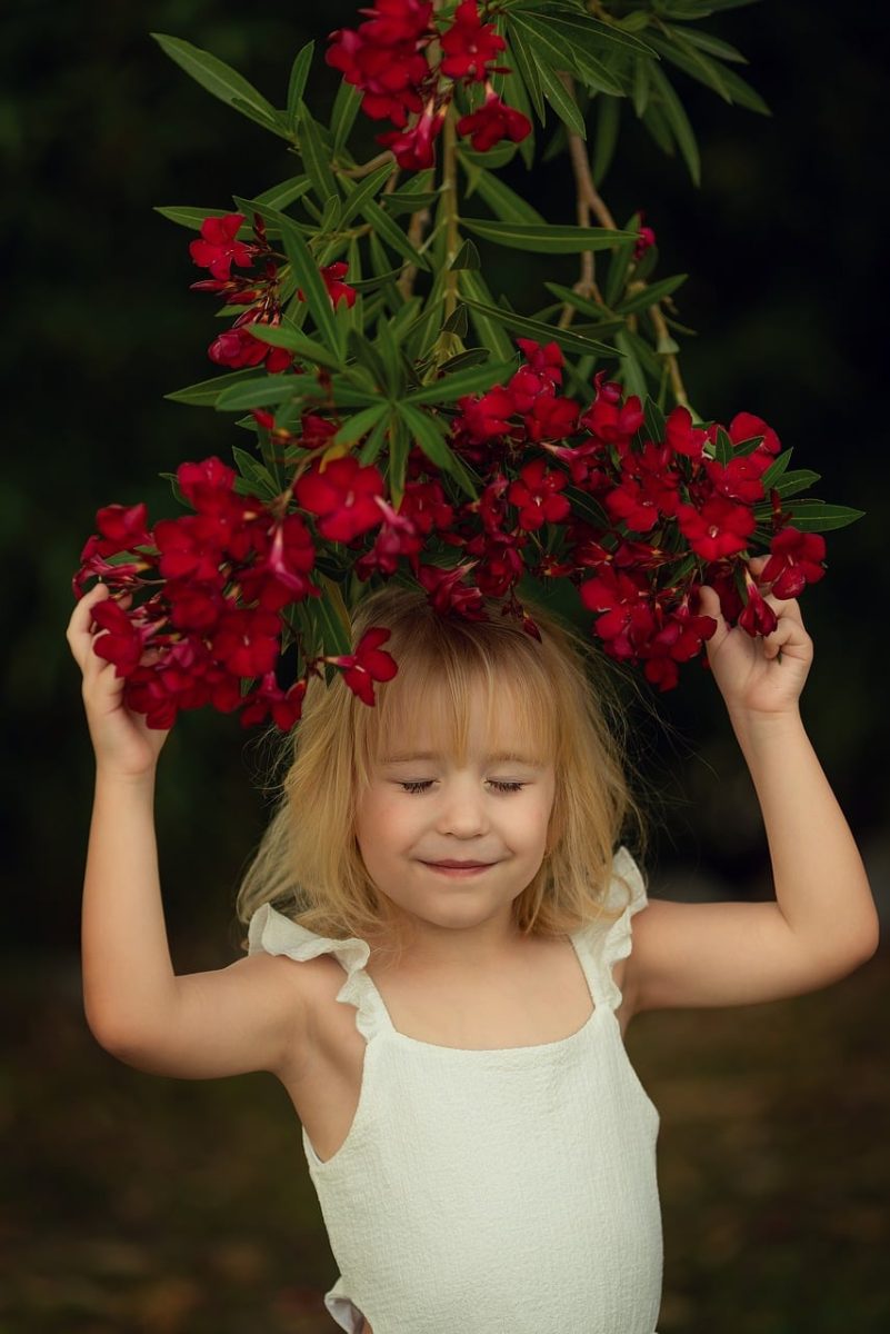 child, flowers, red flowers, oleander, nature, girl, happy, green, outdoors, smile, trees, flower wallpaper, childhood, beautiful flowers, summery, flower background, joy, love, playful, innocent, eyes closed, youth