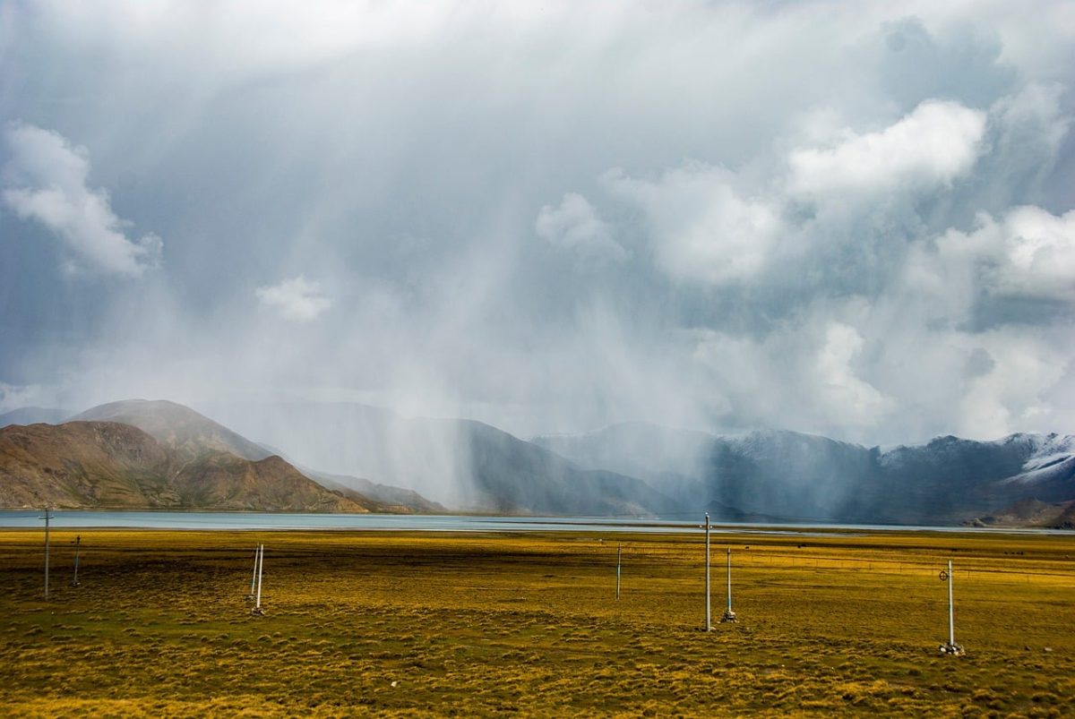 tibet, rain curtain, alpine lake, mountain range, tibetan plateau, storm clouds, dramatic weather, wilderness, grassland, high altitude, power poles, overcast sky, travel, landscape, clouds, nature, rural, remote, roadway, hiking