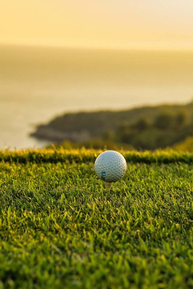 golf ball, golf, ball, close-up, tee shot, focus, golf course, sport, recreation, outdoors, nature, serene, anticipation, minimalist, scenic view
