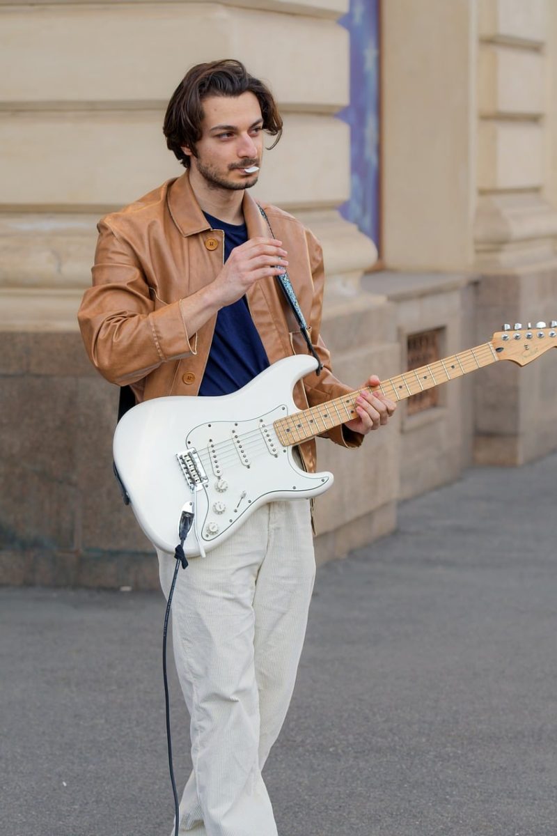 boy, casual, playing, guitar, electric, talent, public place, urban, building, musical, entertainment, attraction, tourism, lifestyle