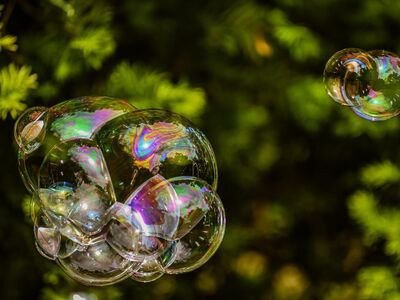 soap bubble, rainbow, outdoor, abstract, green background, nature, reflection, contrast, colorful light, transparency, fragile, macro, magical, calm, light, dazzling, weather, against the light, fantasy, play of light