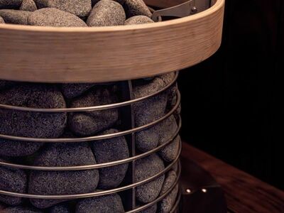 sauna, sauna heater, electric heater, modern sauna, black wood, nordic design, sauna inspiration, dark wood, sauna stones, led lights, nordic architecture, sauna bench, brown wood, black wall, sauna lights, aesthetic, sauna interior, wood, aesthetic sauna