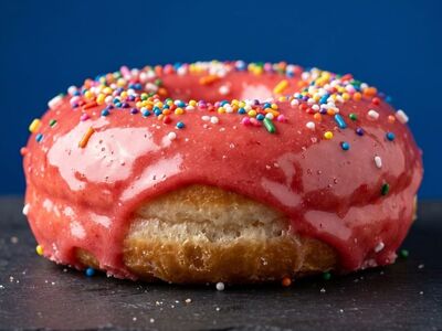donut, pink glaze, sprinkles, sweet, dark background, circular, fried, gourmet, food photography, colorful, confectionary, yellow color, red color, green color, blue color, fresh, festive, coffee accompaniment, pastry, refreshment