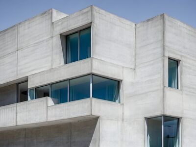 architecture, brutalism, concrete, modern, building, geometric, minimalist, urban, design, facade, windows, blue sky, contemporary, structure, abstract, angular, construction, artistic, monumental, europe