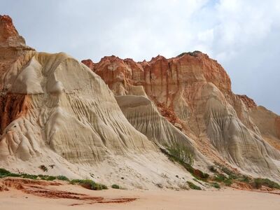 coast, cliffs, natural beauty, sandy beach, geology, clouds, orange rock, tourism, wilderness, coastal landscape, natural formation, eroded, nature, beach cliffs, blue sky, summer day, calm, natural monument, nature world, view, serene environment