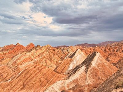 geological formation, mountains, nature, rock formations, colorful layers, sky, nature escape, dramatic sky, tourism, natural wonders, rocky mountains, sand landscape, red-white, dry terrain, panoramic photograph, chinese landscapes, urban parks, landscape without plants, cultural heritage, natural monument