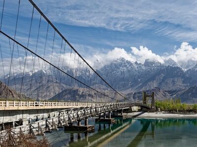 pakistan, bridge, river, mountain range, karakoram, khaplu, snow, nature, mountains, sky, clouds, reflections, shyok river, suspension bridge, northern pakistan, outdoor tourist attractions, tourism, water surface, landscape