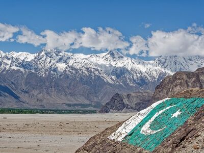 pakistan, gilgit-baltistan, karakoram, mountains, snow, landscape, nature, clouds, sky, rocks, flag, pakistani flag, karakoram mountains, snow-capped mountains, majestic nature, hiking, panorama, terrain, natural beauty