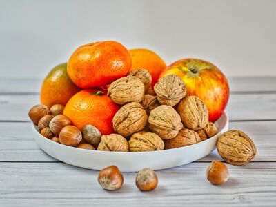 fruit, tangerines, apple, walnuts, hazelnuts, wood, plate, white background, wooden table, fresh food, healthy diet, autumn, vitamins, snack, vegetarianism, natural foods, nuts, dining, wooden floors