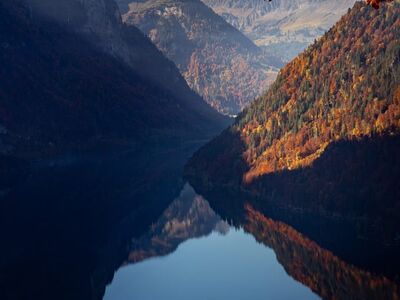 switzerland, klöntalersee, alps, lake, autumn, colors, sunset, reflection, nature, orange, mood, hiking, glarnerland, landscape, photography, calm, tourist destination, idyllic, calm water, mountain landscape, hiking trail
