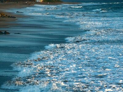 beach, wave, sand, coast, ocean, water, rocks, scenery, sunset, nature, outdoors, twilight, dusk, blue hour, seashore, low tide, wet, kayak, sailing, summer, mountains