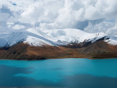 mountains, nature, lake, snow, blue water, sky, panorama, landscape, clouds, winter scene, tranquility, highland landscape, wilderness, natural beauty, hiking, alpine range, nature reserve, peaceful atmosphere, dramatic sky