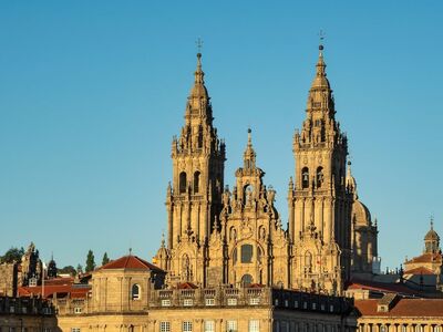 cathedral, santiago de compostela, architecture, historic, landmark, unesco, sun, medieval, tower, rooftops, stone, history, world heritage, clear sky, tourism, pilgrimage site, square, facade, baroque, tourist attraction