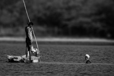 boat, river, fishing, man, woman, paddle, fisherman, traditional, black and white, water, nature, outdoor, traditional clothing, cultural, summer, day, rural, fishing gear, shore