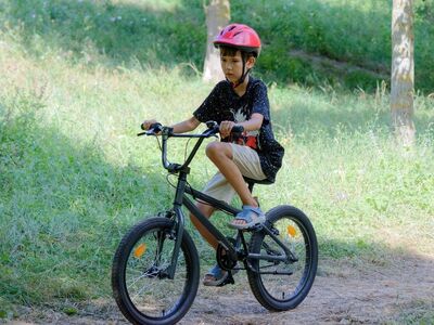 child, helmet, biking, bike ride, boy, bicycle, pathway, nature, park, sports, recreation, trees