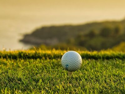 golf ball, golf, ball, close-up, tee shot, focus, golf course, sport, recreation, outdoors, nature, serene, anticipation, minimalist, scenic view