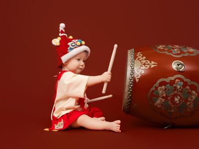 baby, traditional dress, chinese characters, drum, tet, red, smiling baby, asian child, trung thu, traditional drum, cultural festival, child smile, childhood, tet festival, cultural clothing, joyful, asian symbols, children's drum, chinese festivals, family celebration