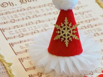 christmas decoration, santa hat, holiday hat, christmas craft, festive ornament, christmas music, sheet music, oh holy night, christmas card, poinsettia, holiday background, winter decoration, handmade ornament, red and white hat, christmas snowflake, glitter snowflake, felt hat, christmas tulle, festive scene, holiday still life, christmas tradition, seasonal decor, cute christmas, cozy holiday, christmas aesthetic