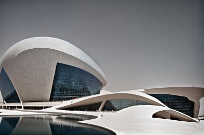 national museum of qatar, architecture, modern, curved, desert rose, doha, futuristic, blue sky, facade, museum, sand-colored, steel construction, middle eastern design, cultural, iconic, geometric, symmetrical, modern art, extravagant, arab culture