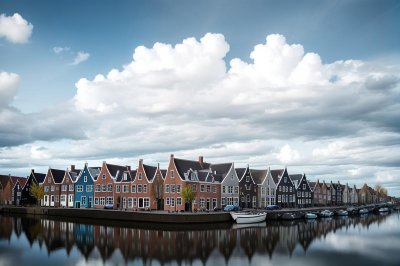 colorful houses, by the water, blue sky, netherlands, flowing water, residential buildings, calm environment, recreation, houses by the canal, architecture, modern design, drinkable water, fresh air, natural beauty, urban landscape, horizon, reflection, autumn day, calm waters, exterior, walk by the water