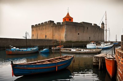 boat, harbor, fortress, fishing gear, old town, wall, ancient architecture, seagull, waterway, sea, stone structure, enclosure, sunset, tide, view, historic site, fishing harbor, nature, ocean view, historic building, harbor view
