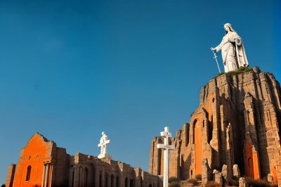 statue, church, pilgrimage site, morning, cross, rock formation, blue sky, mary, warm light, religion, corsica, holy mary, sunset, tower, calvi, religious, sculpture, catholicism, silence, center of faith