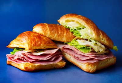 croissant, sandwich, ham, cheese, lettuce, tomato, bakery, breakfast, lunch, food, flaky, buttery, fresh, gourmet, tasty, savory, snack, delicious, crusty, white