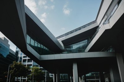 modern architecture, urban view, architectural design, multi-angular building, long angle view, blue sky, office building, modern city, abstract architecture, minimalist aesthetics, skyscraper, light reflection, urban architecture, geometric patterns, window facade, urban environment, building structure, outdoor view, building construction, modern offices