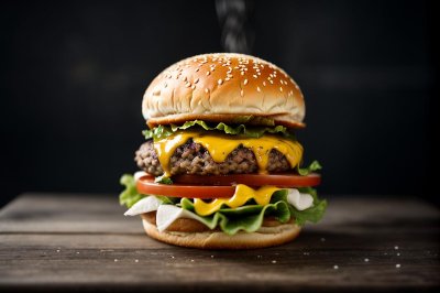 burger, cheeseburger, hamburger, sandwich, fast food, beef patty, cheese, melted cheese, lettuce, tomato, red onion, sauce, bun, sesame seeds, slate plate, meal, lunch, dinner, tasty, delicious, gourmet, blue background
