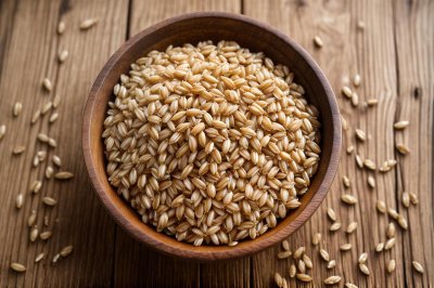 barley, pearl barley, grain, whole grain, wooden bowl, fiber, raw grain, pantry, healthy carb, nutrition, uncooked, food, wooden table, dried, cooking, ingredient, plant-based diet, carbohydrates, organic