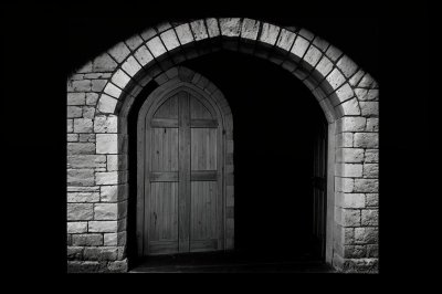 stone archway, wooden door, open gateway, arch, historic architecture, construction, medieval style, stone masonry, arched entrance, medieval castle, wooden door handle, rustic style, passageway, antiquity, traditional design, leafy arch, shady space, decorative element, grill, castle appearance