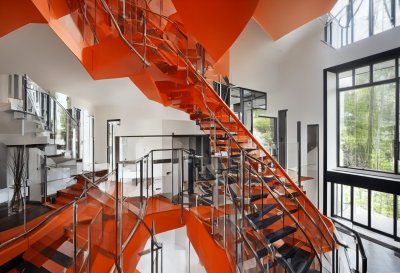 ai generated, modern staircase, open tread stairs, grand entryway, double story foyer, stone accent wall, metal railing, indoor architecture, luxury hallway, modern interior design, wood flooring, large windows, scandinavian style, natural lighting, plant decor, cozy atmosphere, large entrance, house in the woods
