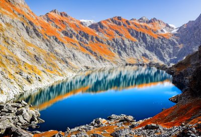 lake, mountains, switzerland, alps, reflection, cliffs, nature, rock face, clear water, tourist site, hiking, natural beauty, relaxation, light, silence, hiker, outdoor activities, blue sky